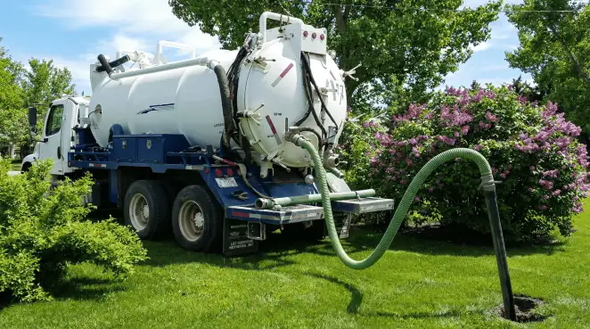 Professional vacuum truck performing residential drainage and septic maintenance in Columbus, OH